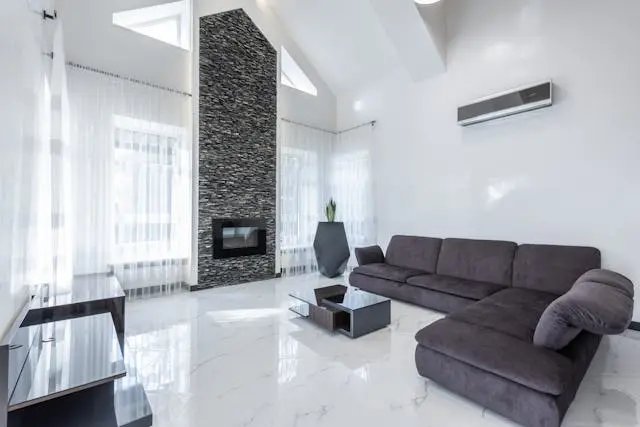sala con muebles y aire acondicionado